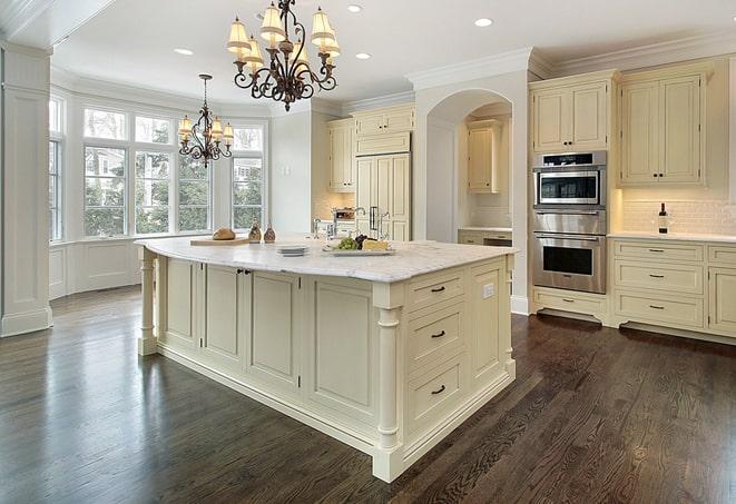 a modern kitchen with newly installed laminate floors in Borden IN